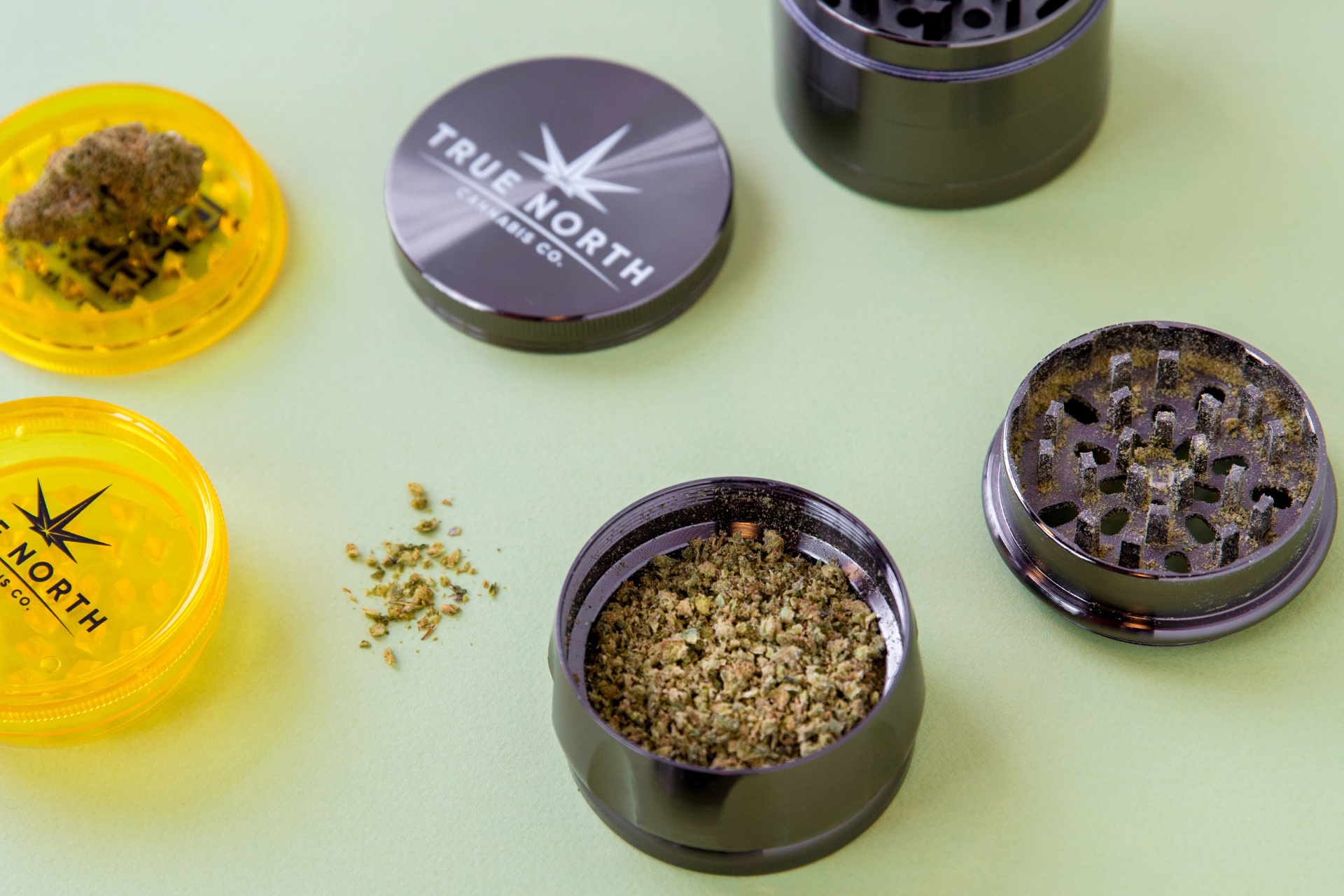 True North Cannabis Co. branded grinders with cannabis ground in them