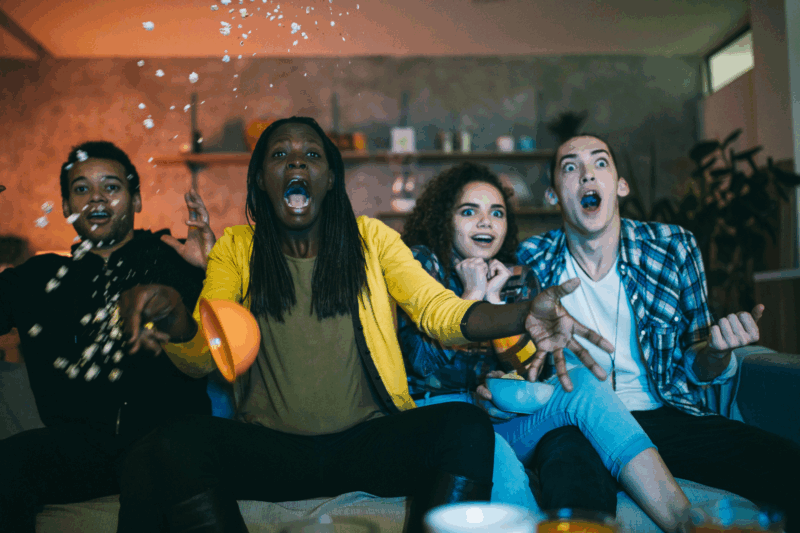 A group of friends scared while seeing some of the best horror movies to watch while high