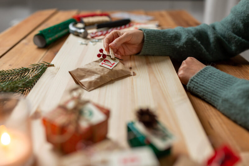 A woman puts the finishing touches on her cannabis advent calendar