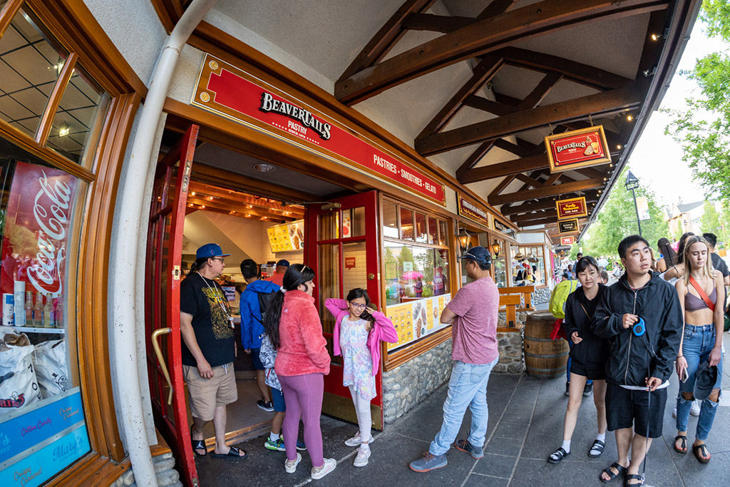 Fisheye lens view of the BeaverTails pastry store with customers in line outside