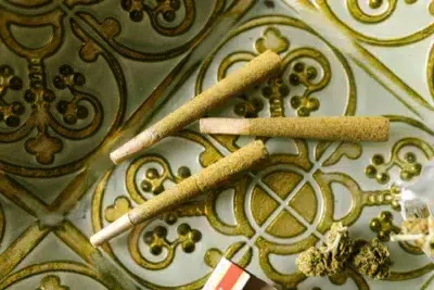 three infused pre-roll joints and some cannabis
