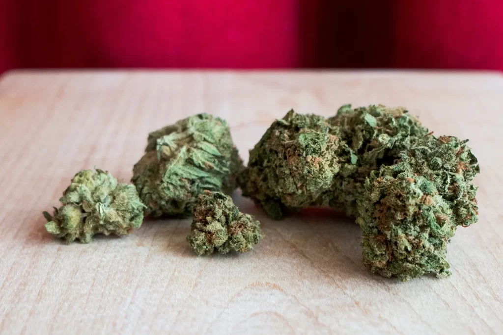 A bunch of cannabis flower on a wooden table