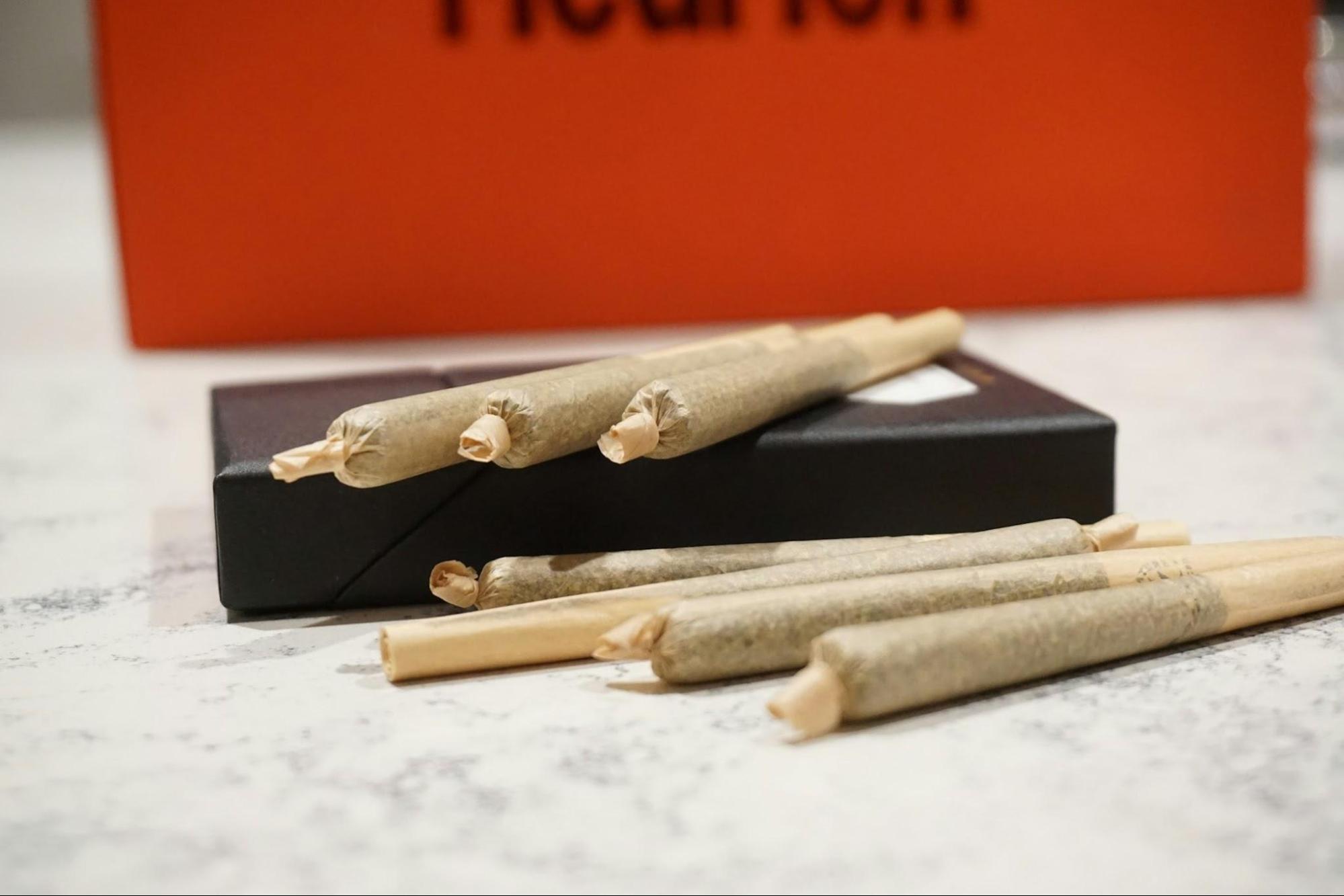 A stack of pre-roll joints on a table