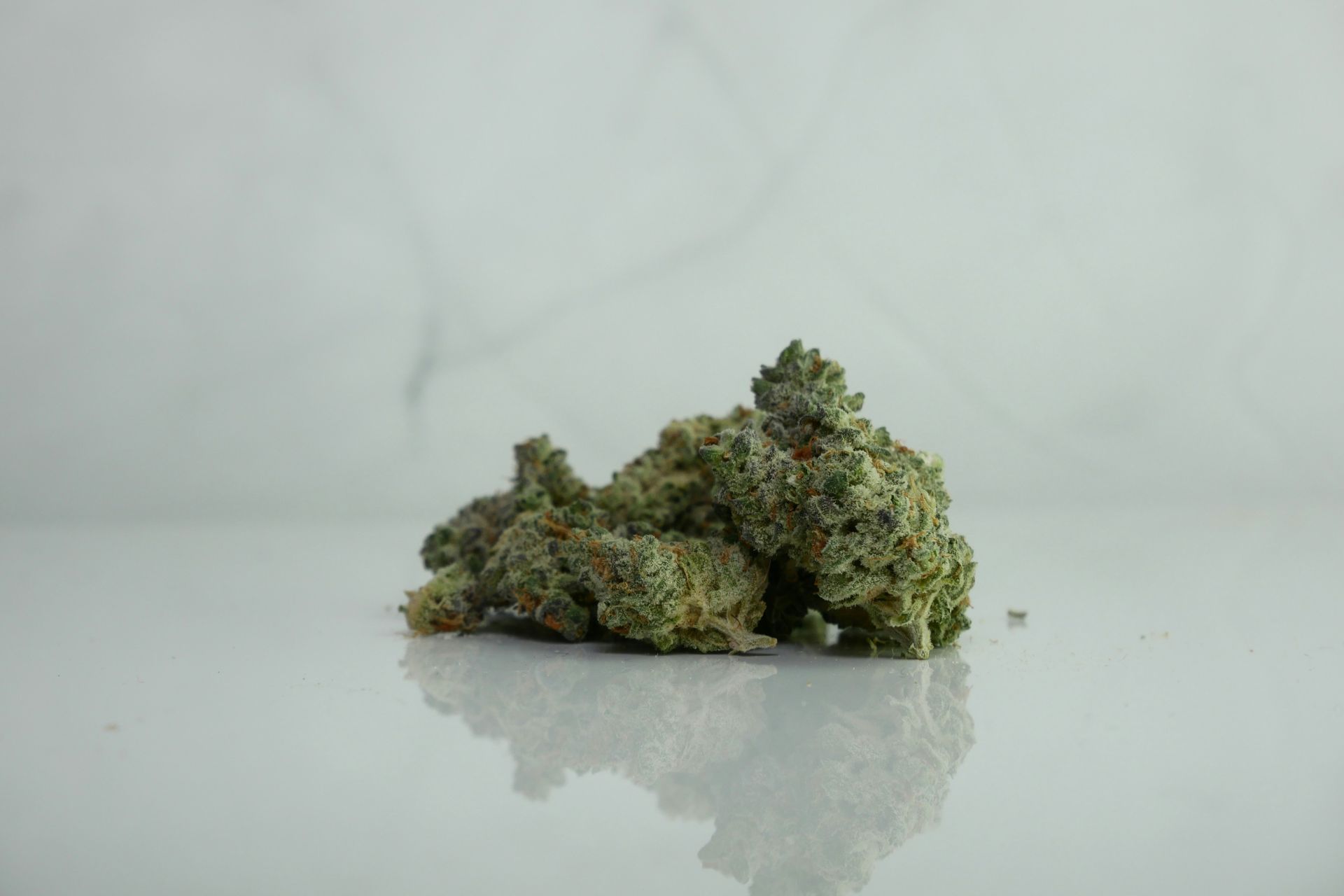A couple of cannabis buds on a table