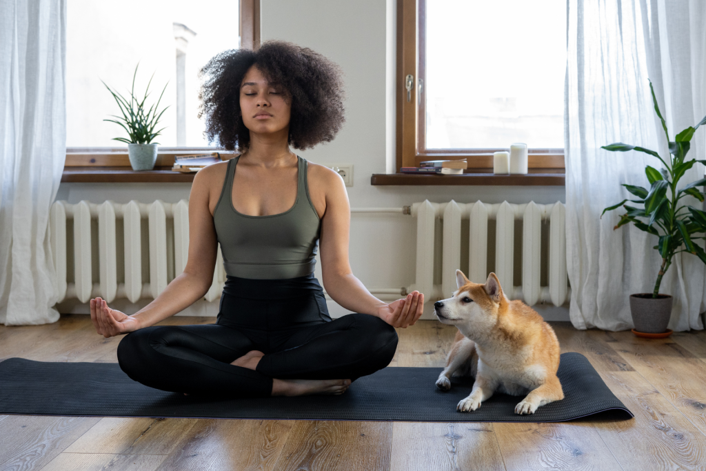a woman meditating at home