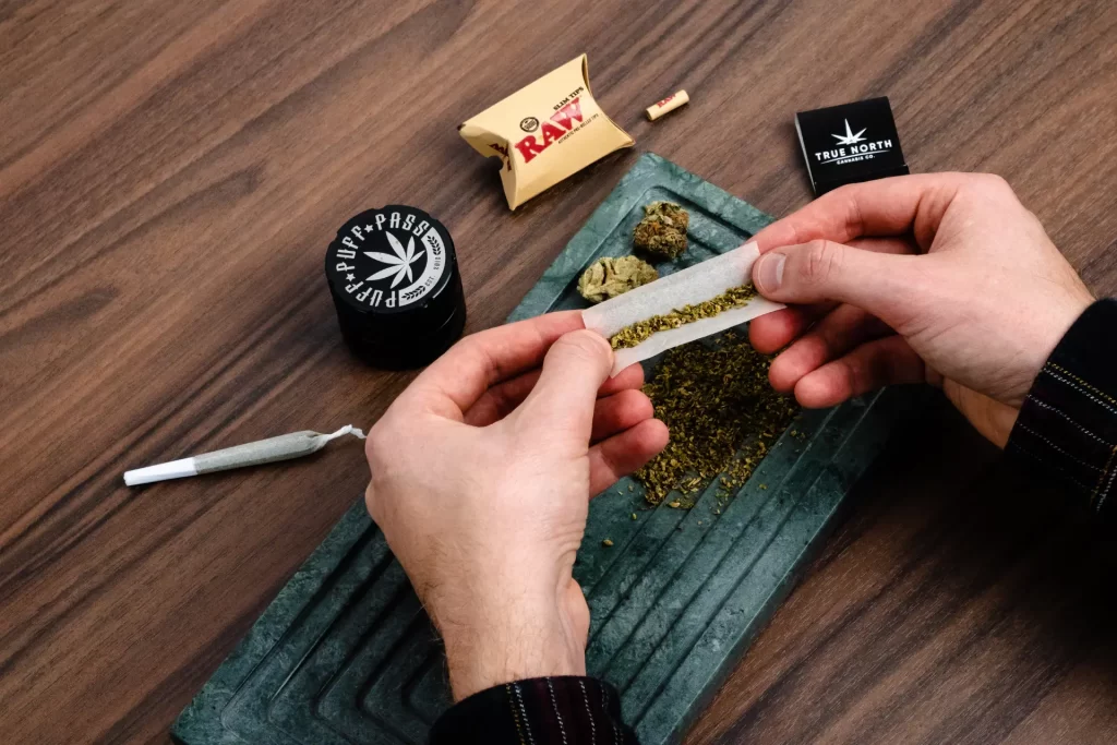 A person rolling a joint