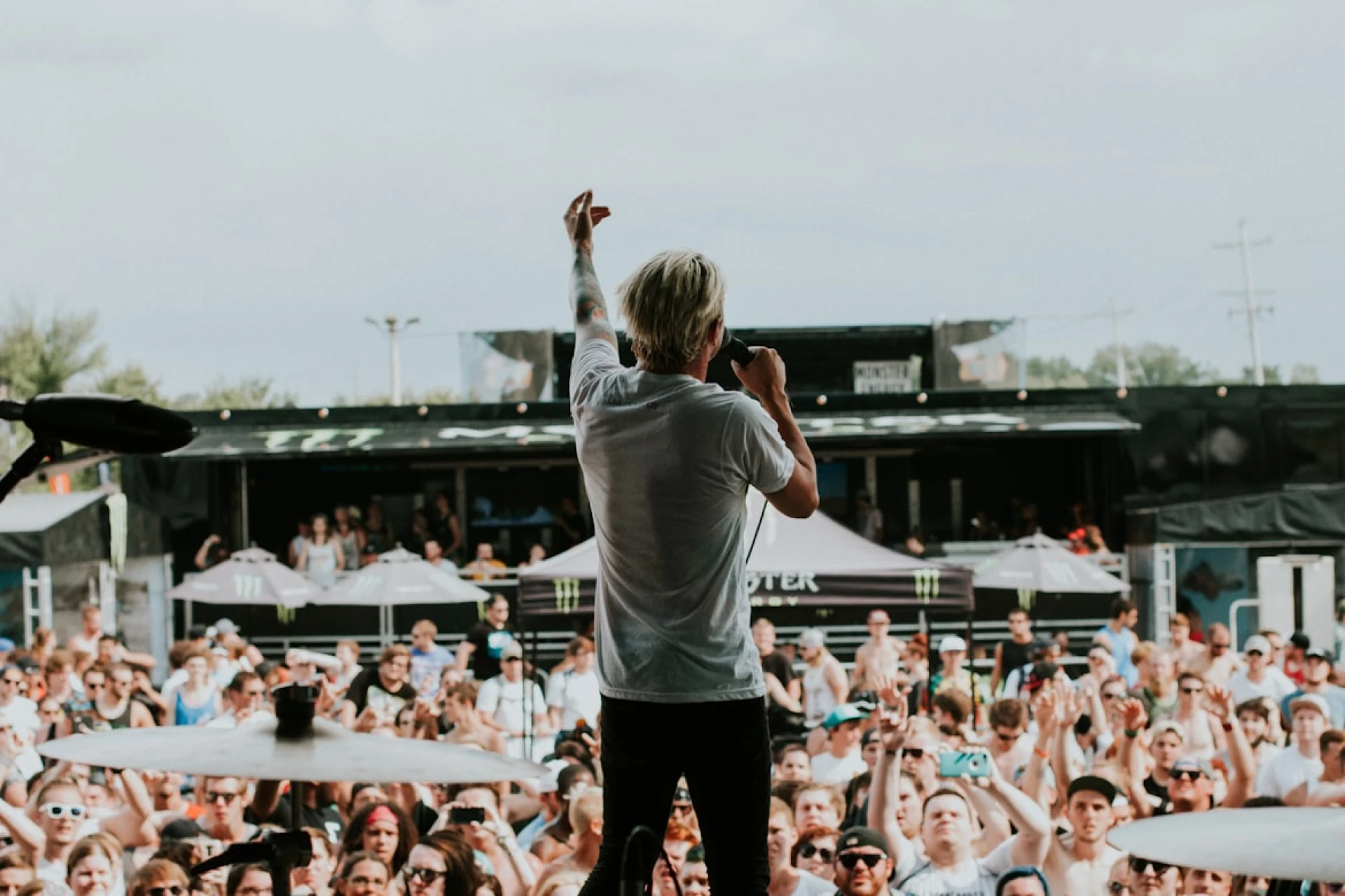 A music artist performing a song to a live crowd
