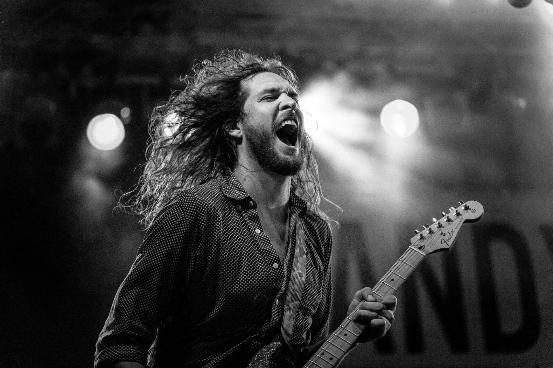 A rock artist performing at a live concert