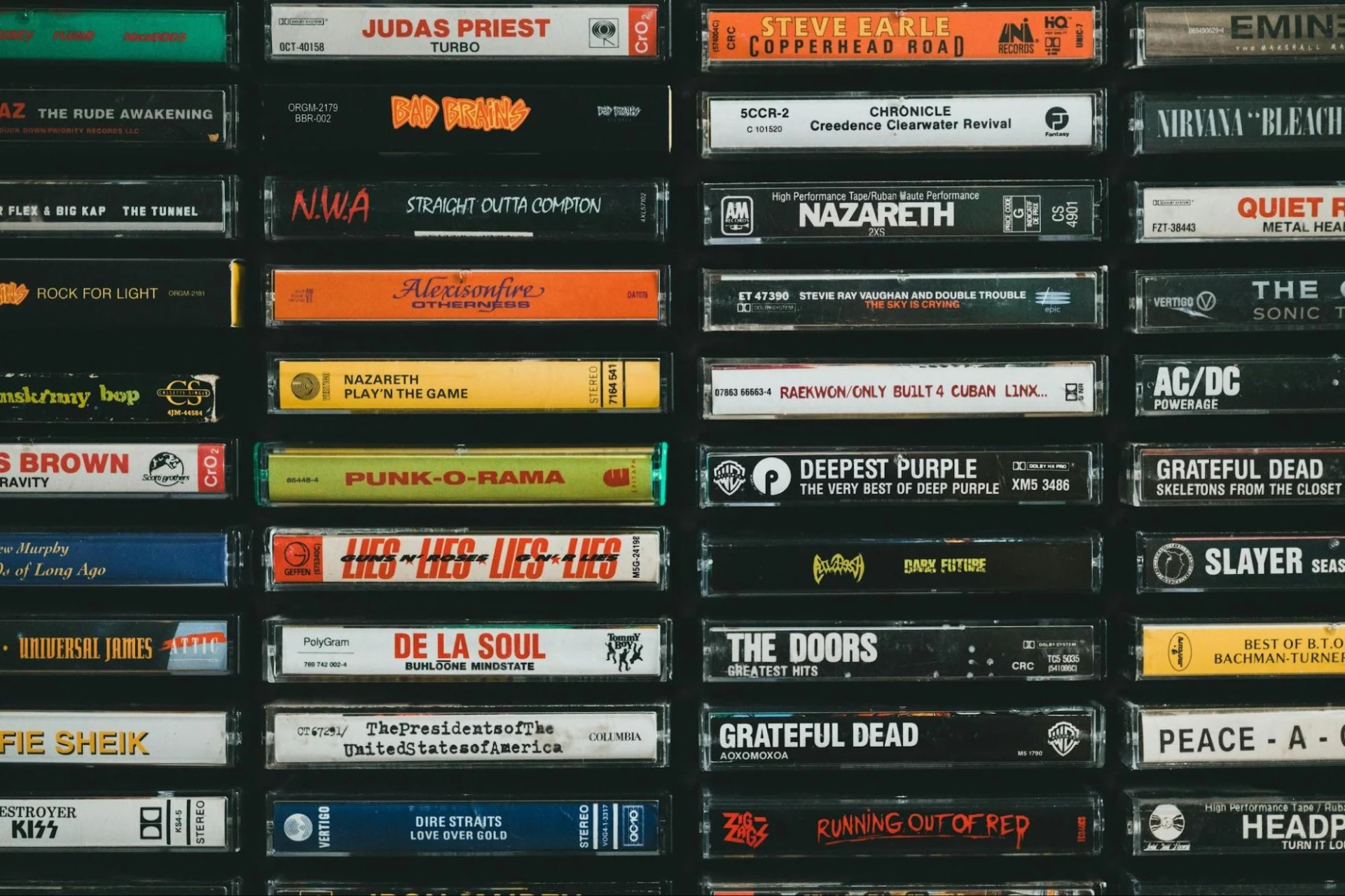 Stacks of cassette tapes from various artists