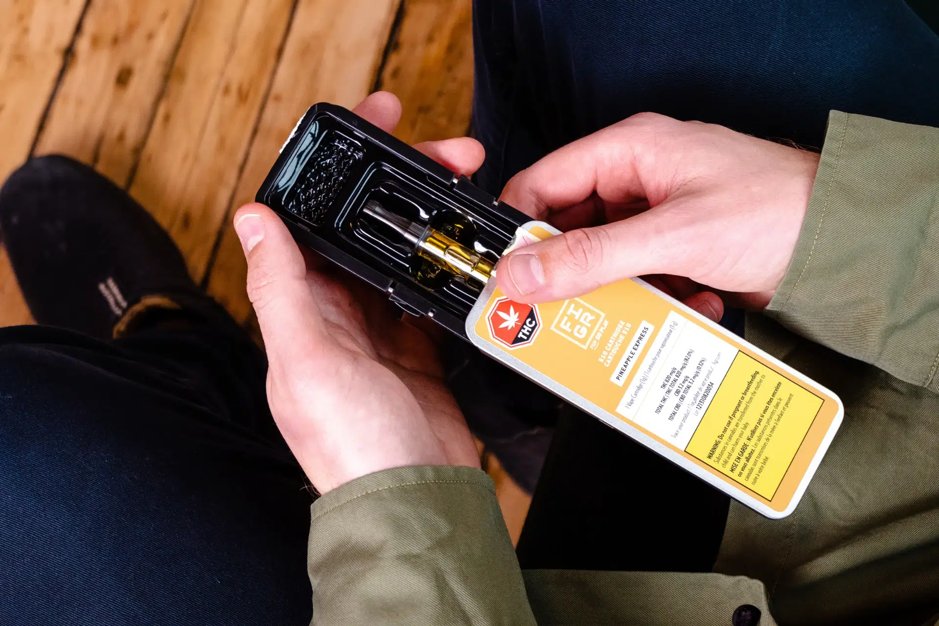 a person opening a new vape